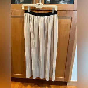 Velvet midi length skirt with stretchy waistband.